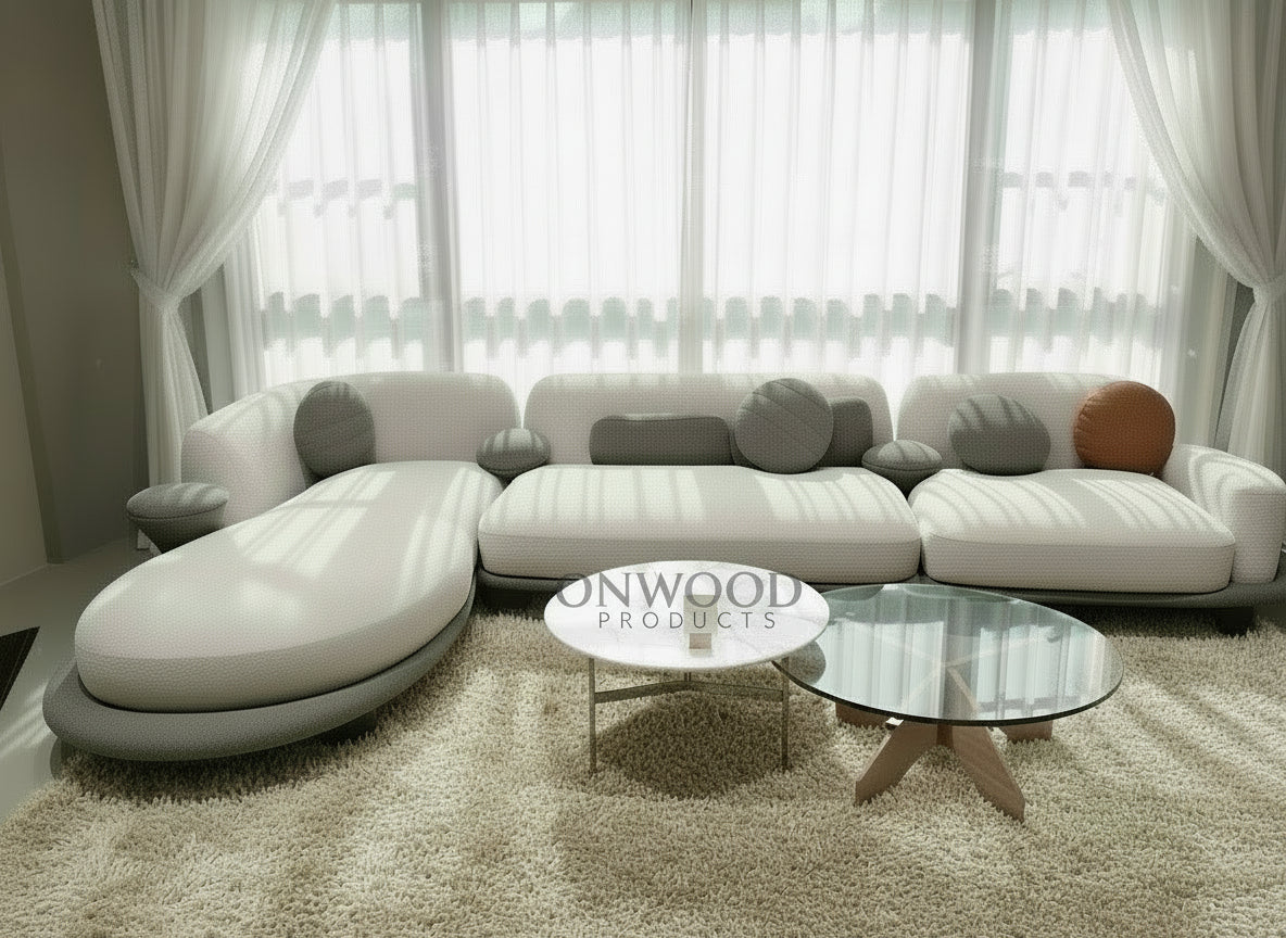 Modern sectional sofa in a living room with abstract art on the wall.